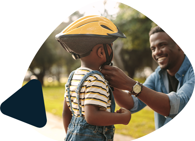 Father fitting a cycling helmet